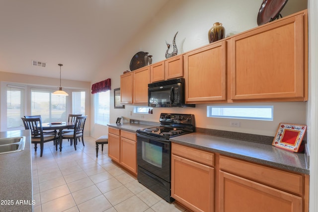 kitchen with pendant lighting, light brown cabinets, lofted ceiling, black appliances, and light tile patterned floors