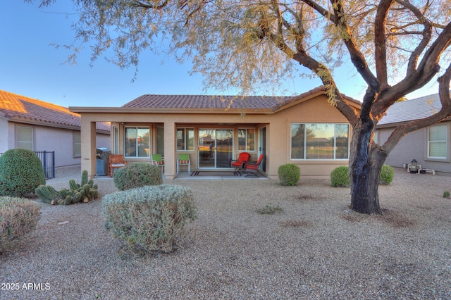 back of house with a patio area