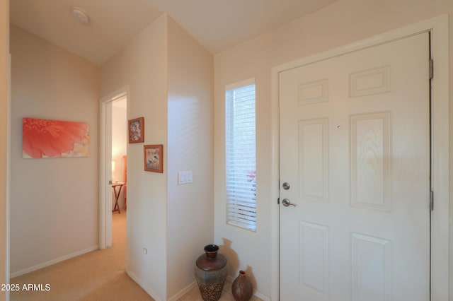 foyer with light carpet