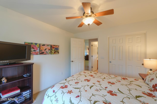 bedroom with ceiling fan and a closet