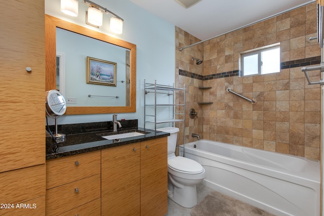 bathroom featuring vanity, toilet, and shower / bathtub combination