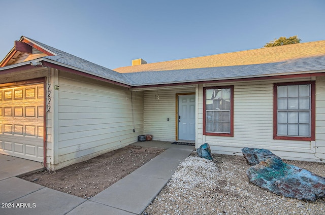 view of front of property with a garage