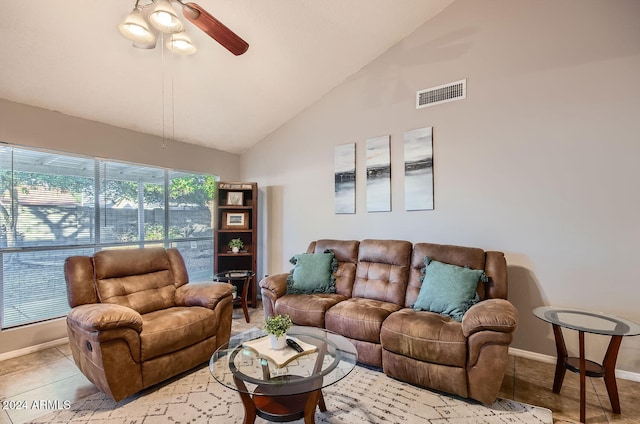 tiled living room featuring ceiling fan and high vaulted ceiling