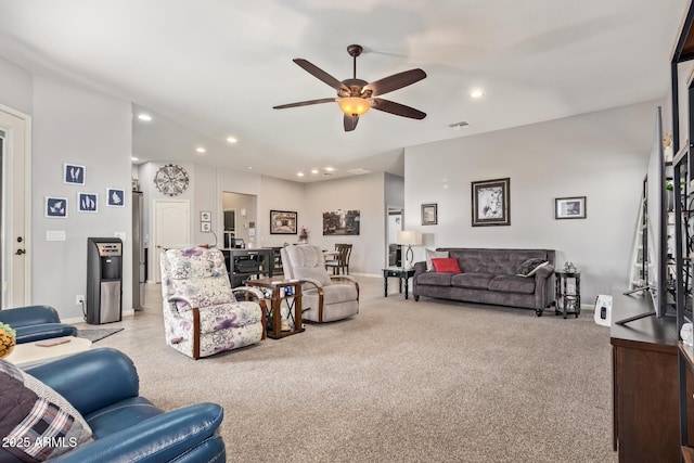 living room with carpet flooring, a ceiling fan, recessed lighting, and visible vents