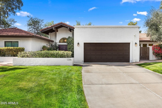 mediterranean / spanish-style home with a garage and a front lawn