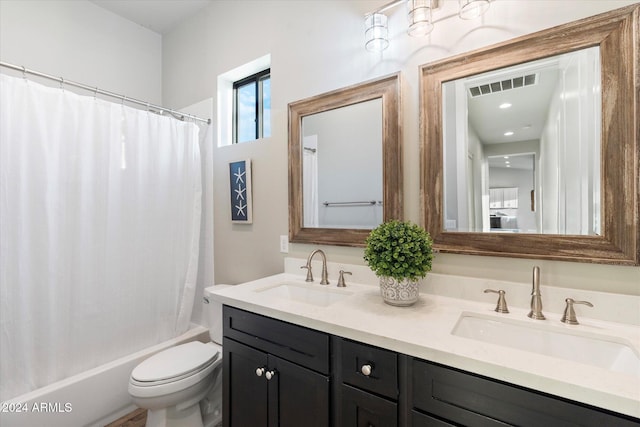 full bathroom with shower / bath combination with curtain, vanity, and toilet