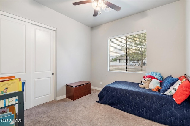 bedroom with carpet floors, a closet, and ceiling fan