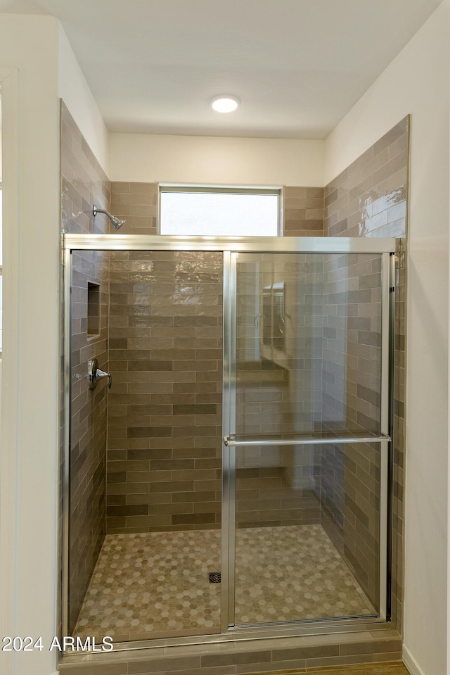 full bathroom with a shower stall