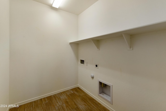 laundry room with baseboards, hookup for a gas dryer, washer hookup, laundry area, and wood finished floors