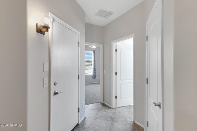 hallway featuring light tile patterned floors