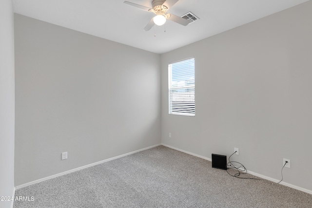 empty room featuring ceiling fan and carpet flooring