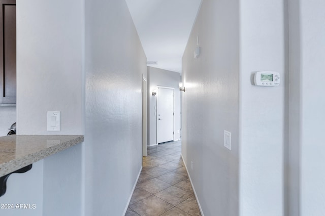 corridor with light tile patterned flooring