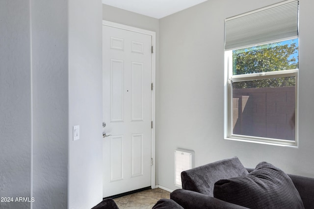 interior space with light tile patterned floors