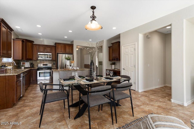 dining room featuring sink