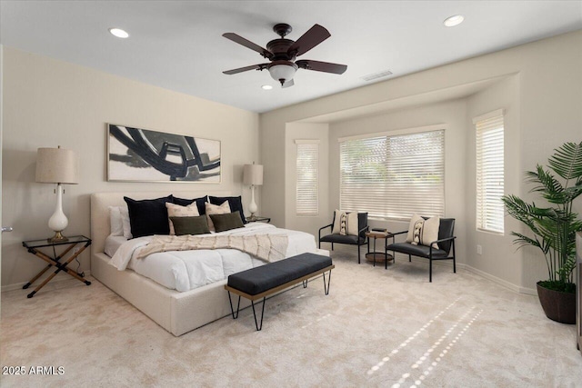 bedroom with light colored carpet and ceiling fan