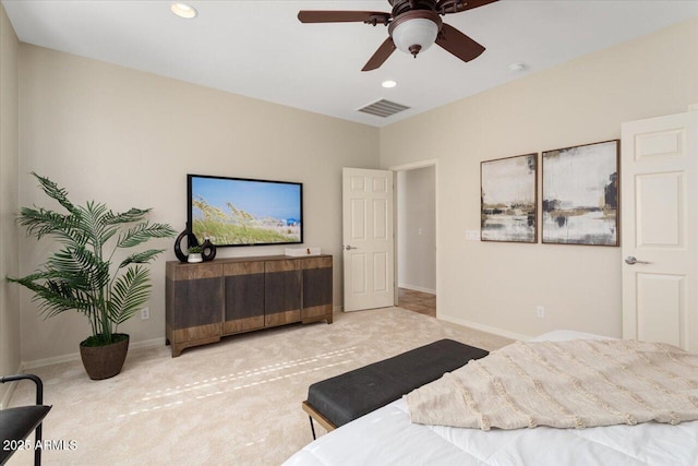 bedroom featuring ceiling fan and light carpet