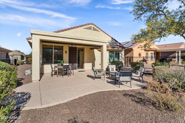 rear view of house featuring a patio area