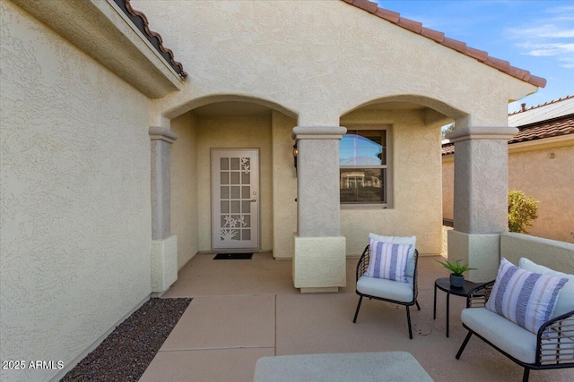 doorway to property with a patio area