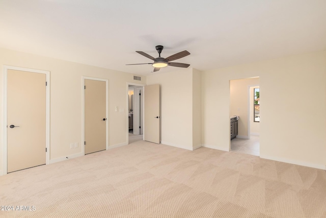 interior space with ceiling fan