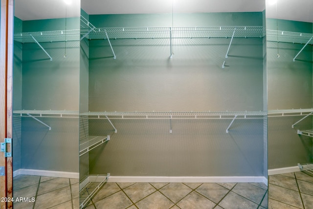 spacious closet featuring tile patterned floors