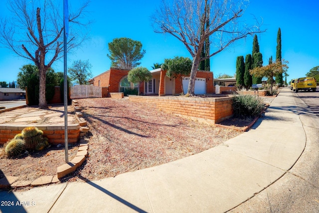 ranch-style home featuring a garage