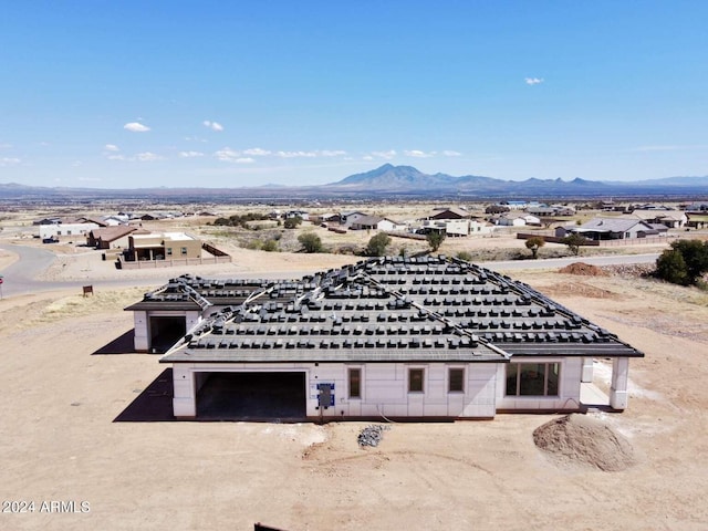 birds eye view of property featuring a mountain view