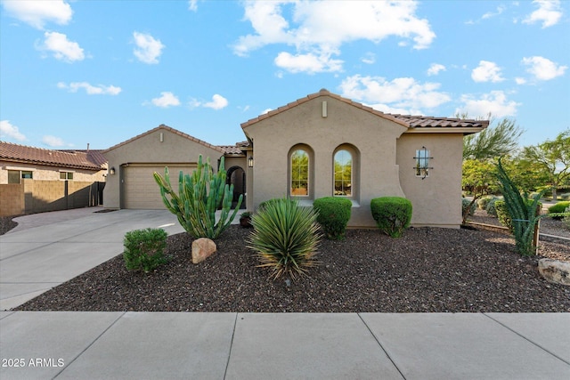 27308 N 56th Dr, Phoenix, AZ 85083 - mediterranean / spanish-style house with driveway, fence, stucco siding, a garage, and a tiled roof