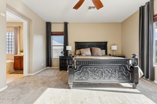 27308 N 56th Dr, Phoenix, AZ 85083 - carpeted bedroom featuring ensuite bathroom, baseboards, and ceiling fan