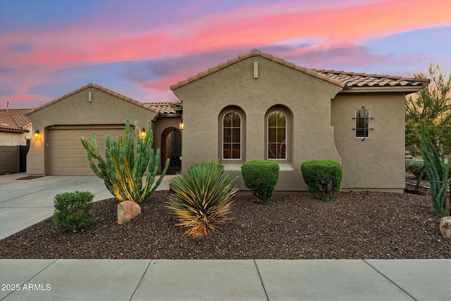 27308 N 56th Dr, Phoenix, AZ 85083 - mediterranean / spanish-style home with a garage, stucco siding, driveway, and a tile roof