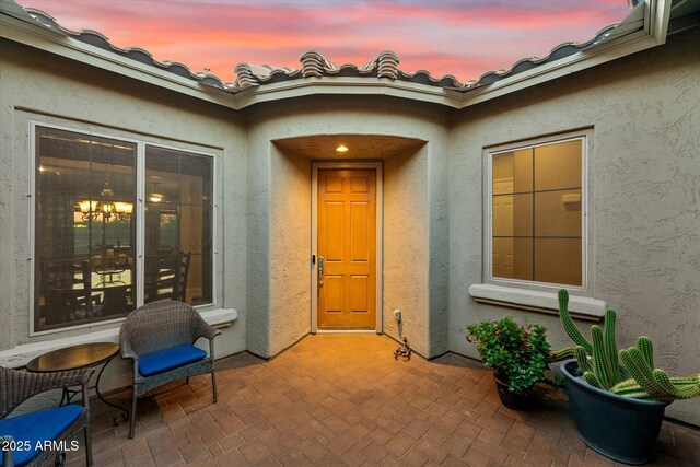 27308 N 56th Dr, Phoenix, AZ 85083 - doorway to property featuring stucco siding and a patio area