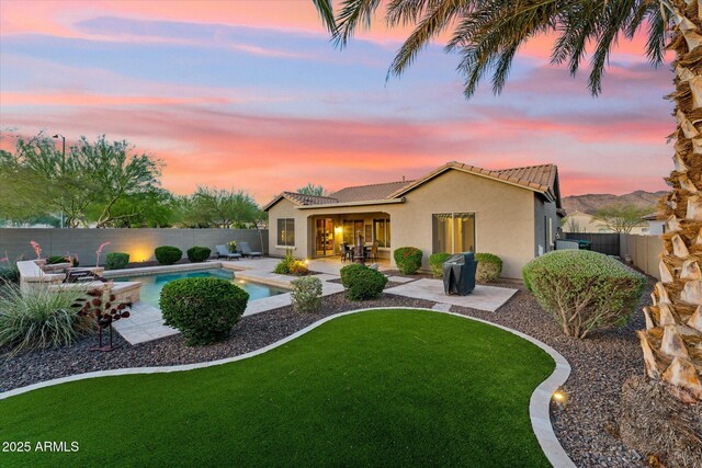 27308 N 56th Dr, Phoenix, AZ 85083 - back of property with a tile roof, stucco siding, and a patio
