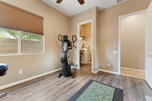 27308 N 56th Dr, Phoenix, AZ 85083 - exercise room featuring a ceiling fan, wood finished floors, and baseboards