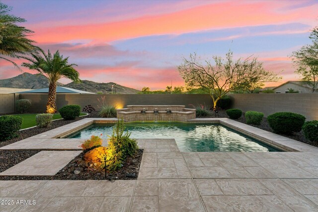 27308 N 56th Dr, Phoenix, AZ 85083 - pool at dusk with a fenced backyard and a patio area