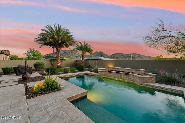 27308 N 56th Dr, Phoenix, AZ 85083 - pool at dusk featuring a fenced backyard and a patio