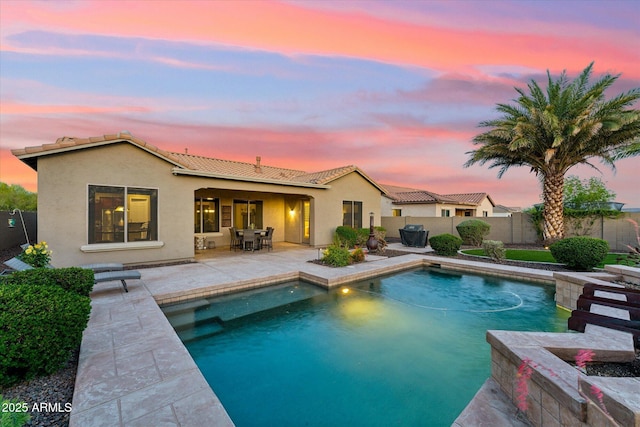 27308 N 56th Dr, Phoenix, AZ 85083 - pool at dusk with a fenced backyard and a patio area