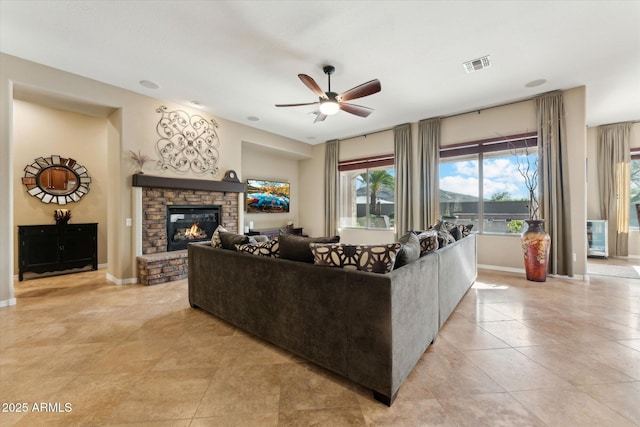27308 N 56th Dr, Phoenix, AZ 85083 - living area with ceiling fan, a fireplace, light tile patterned floors, and baseboards