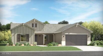 view of front of property featuring a garage and a front lawn