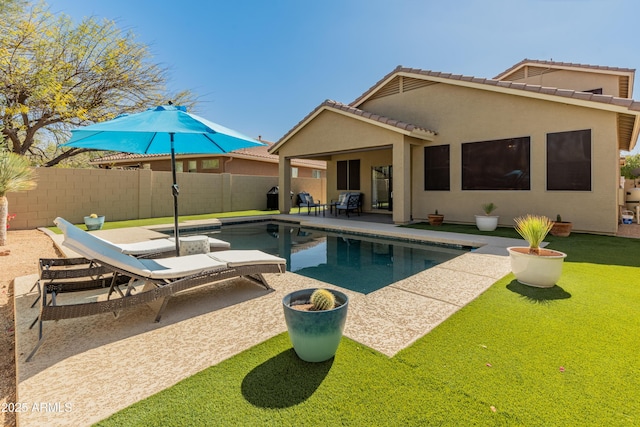 view of swimming pool with a fenced backyard, a fenced in pool, and a patio