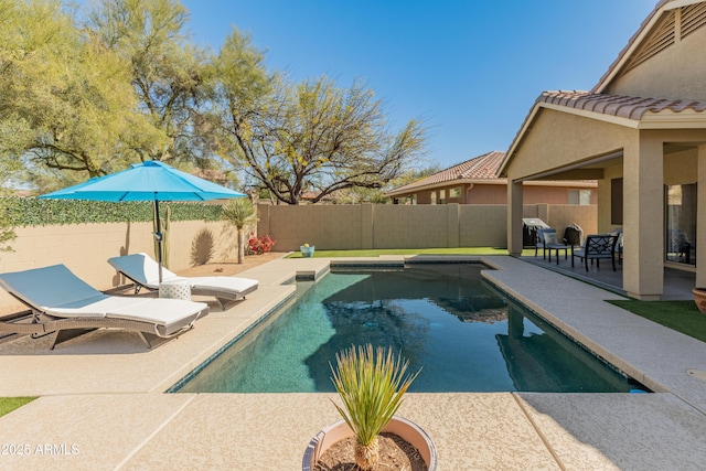 view of swimming pool with a fenced in pool, a patio area, and a fenced backyard