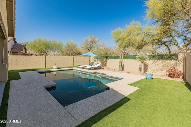 view of swimming pool with a fenced in pool, a fenced backyard, a yard, and a patio