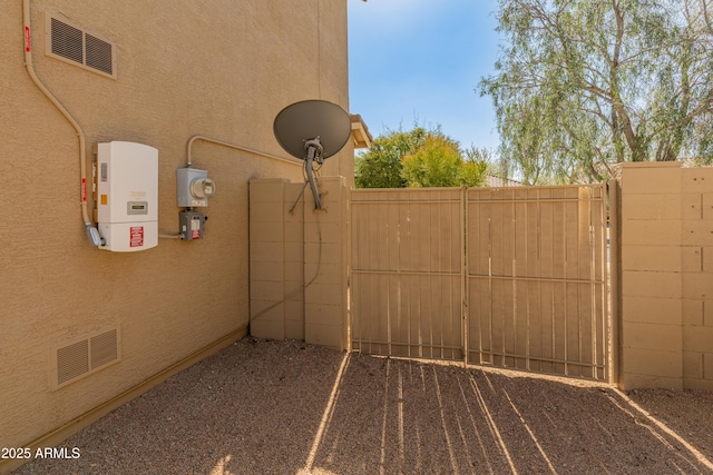 view of yard with visible vents and fence