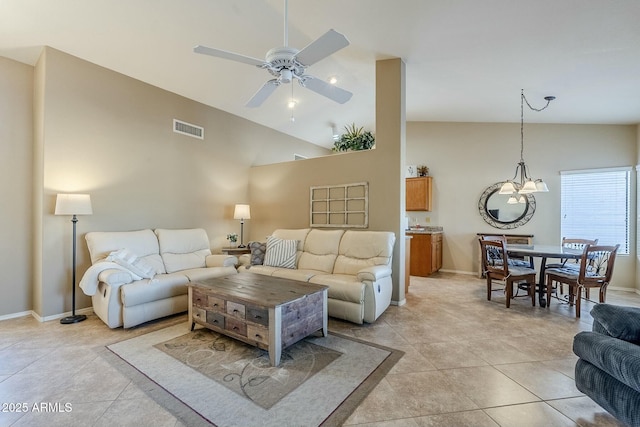 living room featuring ceiling fan, light tile patterned flooring, and high vaulted ceiling