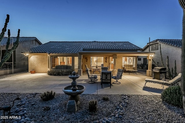 back of house featuring a patio