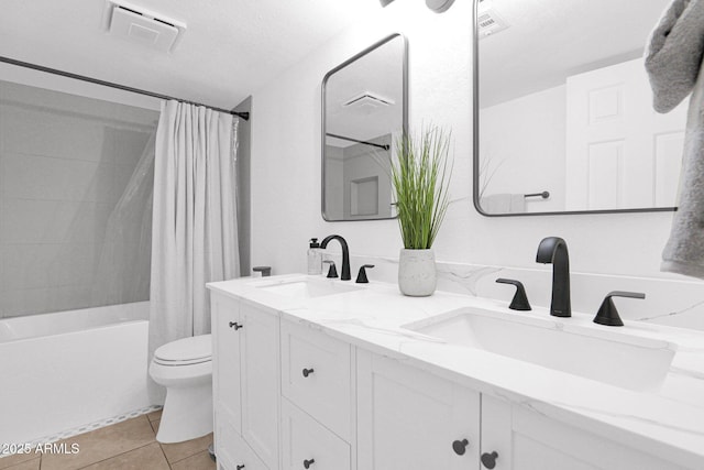 full bathroom with a sink, visible vents, toilet, and tile patterned floors