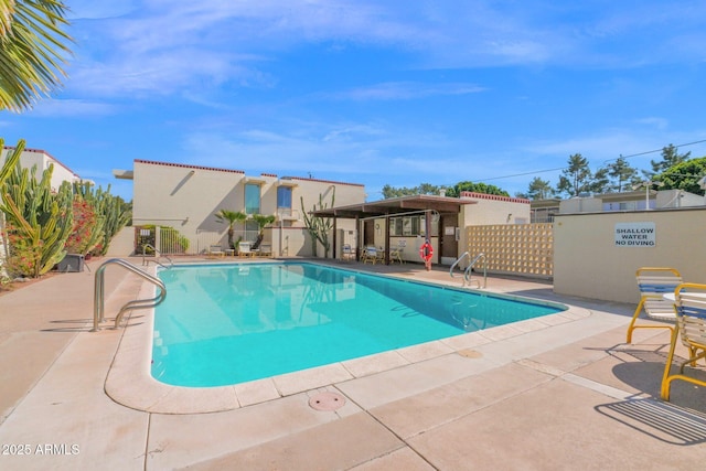 community pool with a patio area