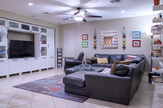 tiled living room featuring ceiling fan