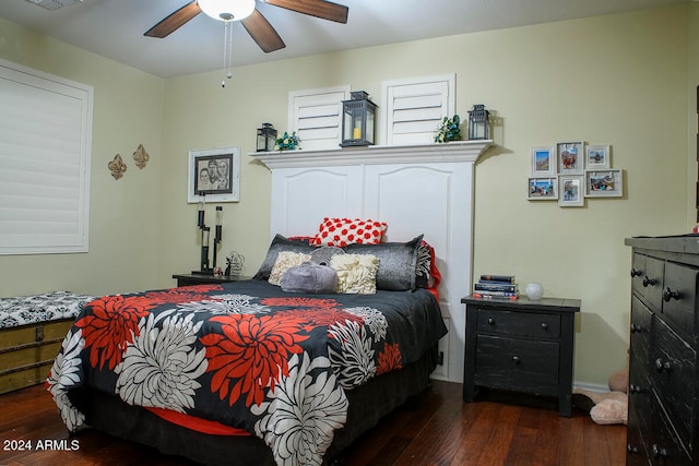 bedroom with dark wood-type flooring and ceiling fan