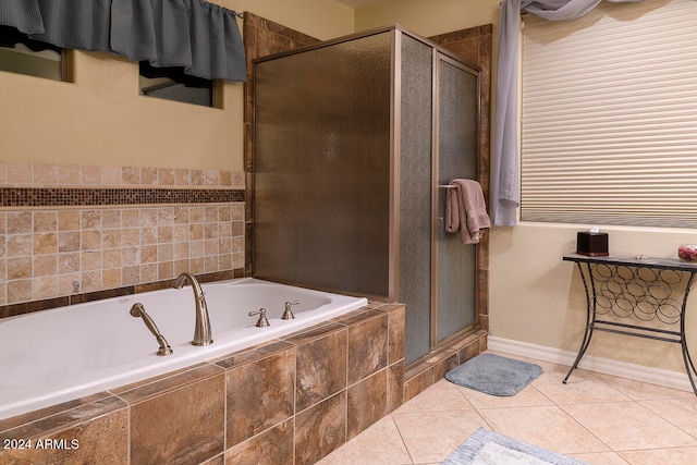 bathroom with tile patterned flooring and plus walk in shower