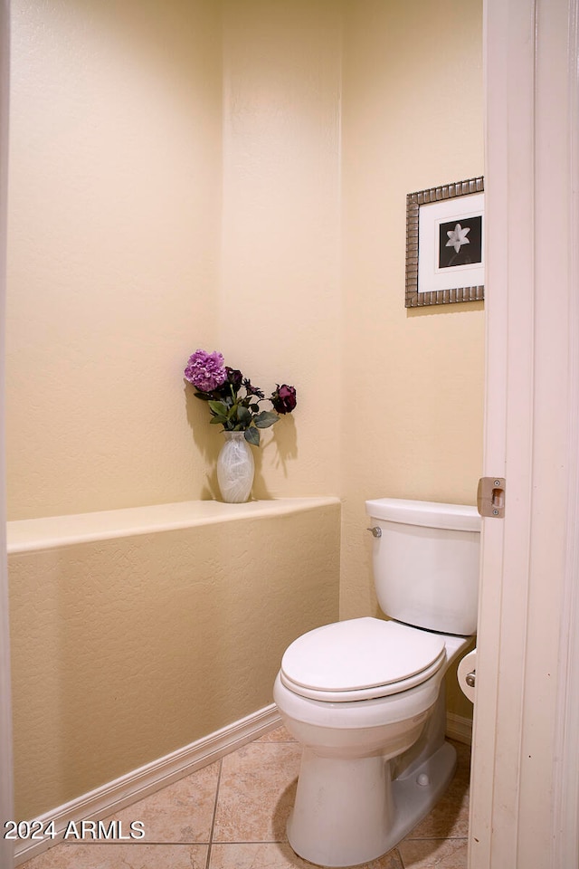 bathroom with tile patterned floors and toilet