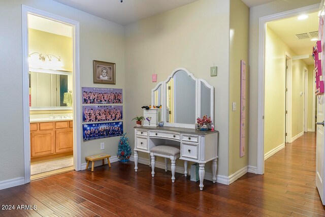 hallway with dark hardwood / wood-style flooring